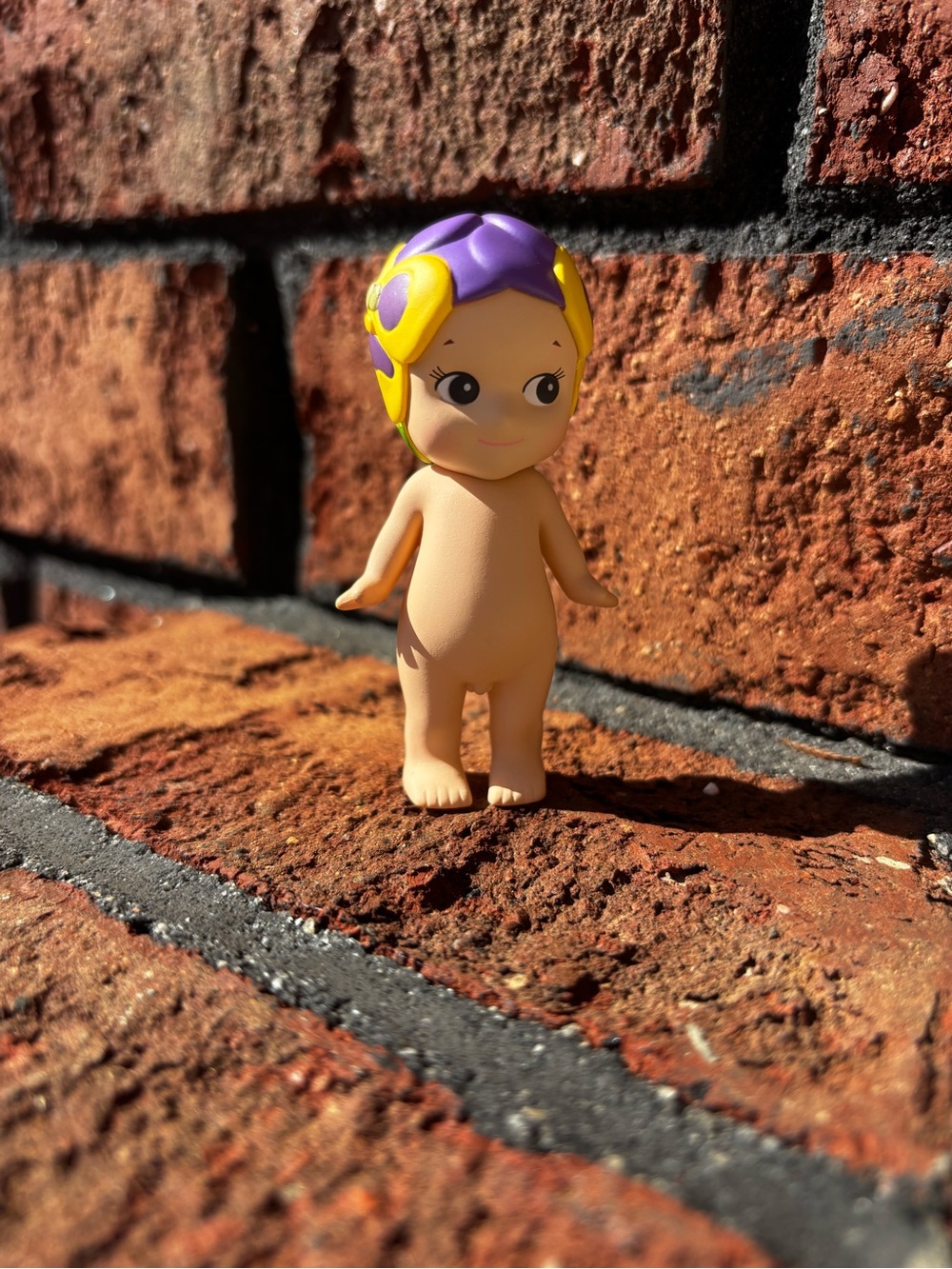 Purple & Yellow Mini Baby Doll Figurine - Collectible Home Decor
